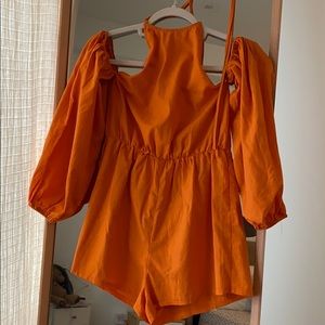 Pretty little thing halter back orange romper